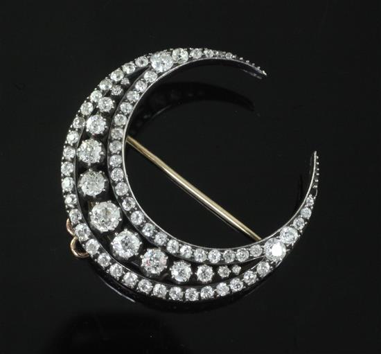 A Victorian gold, silver and diamond crescent brooch 36mm.